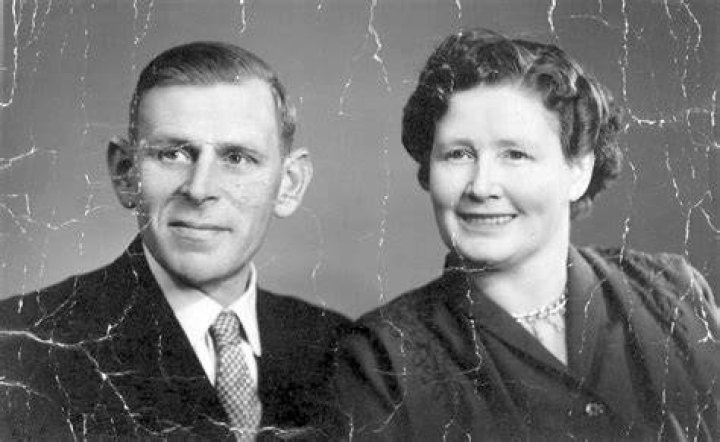 an old black and white photo of two women sitting next to each other