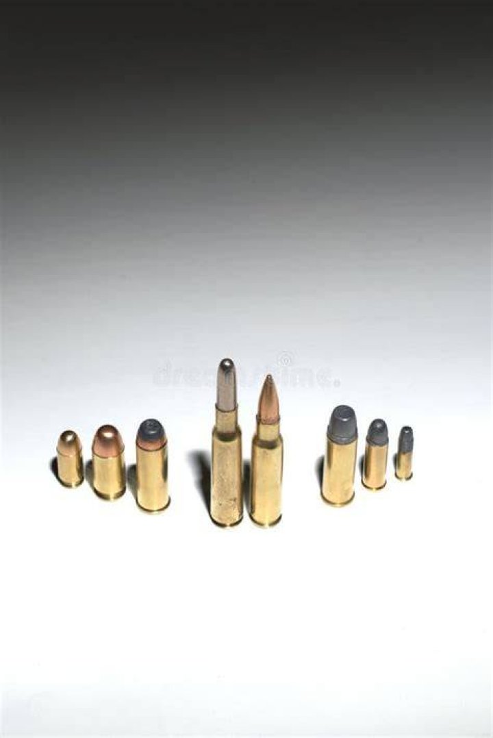 Crime Family Concept. Several Bullet Standing On A White Surface