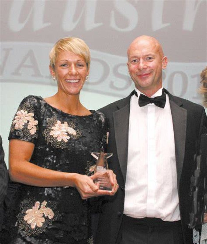Darren & Sarah accepting award from Pet Care Trade Association winning