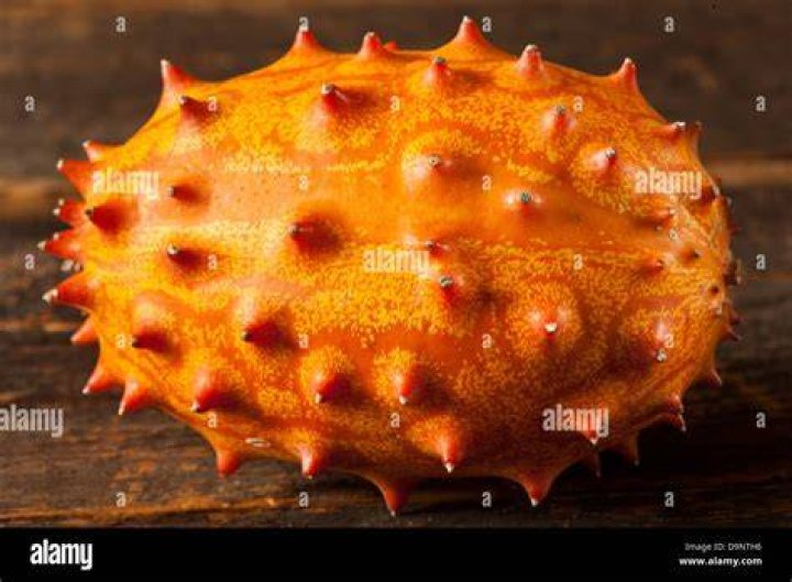 Found this orange spiky fruit with bright red seeds in Ft. Lauderdale