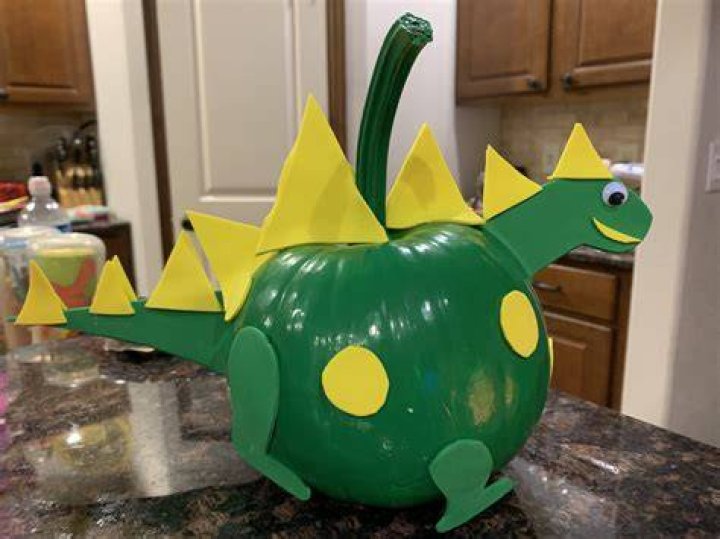 Painted Dinosaur Pumpkin with yellow adhesive foam dinosaurpumpkin 